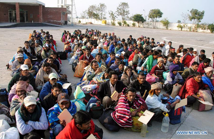 Released Indian fishermen wait for immigration clearance at Wagah Border in eastern Pakistan's Lahore, on Jan. 8, 2012. Pakistan released nearly 179 Indian fishermen and another Indian citizen on Saturday from a prison in the southern port city of Karachi, a state-run television reported on Saturday. 