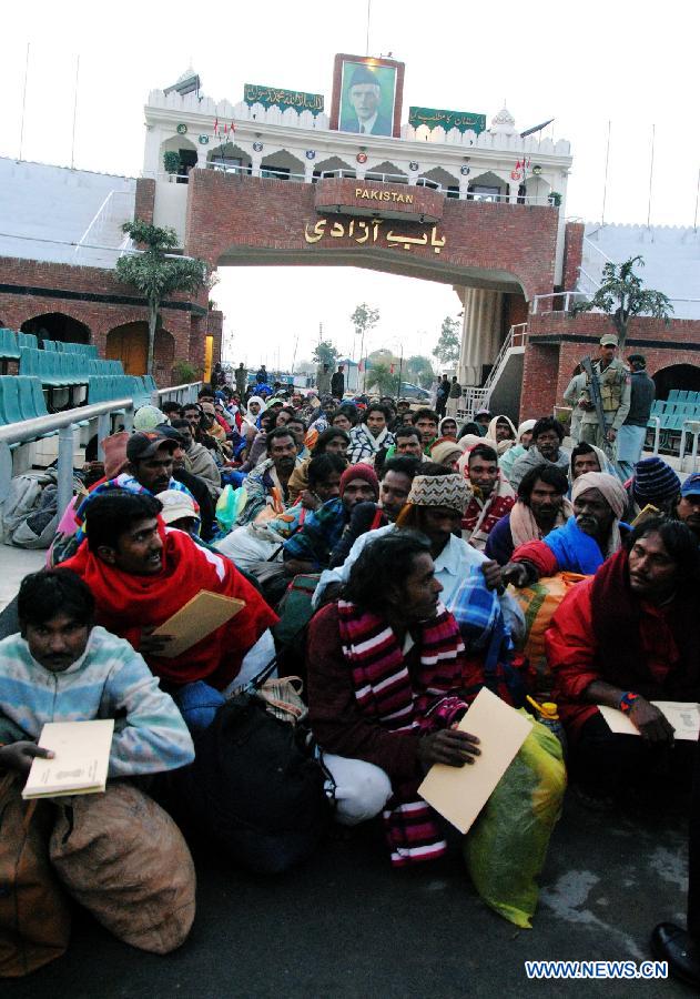 Released Indian fishermen wait for immigration clearance at Wagah Border in eastern Pakistan's Lahore, on Jan. 8, 2012. Pakistan released nearly 179 Indian fishermen and another Indian citizen on Saturday from a prison in the southern port city of Karachi, a state-run television reported on Saturday. 