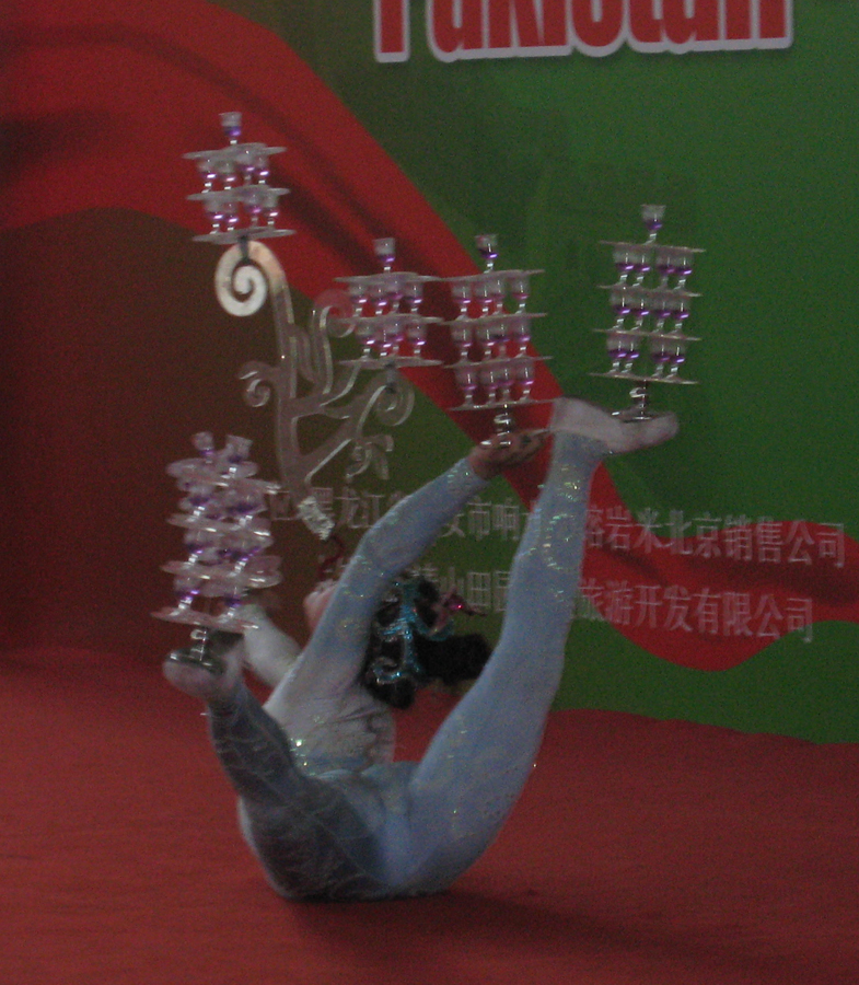 A girl performs acrobatics during a cultural show which is held to celebrate the 60th anniversary of the establishment of diplomatic relations between China and Pakistan in Beijing, Jan. 11, 2011. [Zhang Ming'ai/China.org.cn]