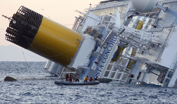 Rescuers search for survivors on Sunday of the crippled Costa Concordia cruise ship that ran aground off the west coast of Italy. At least three people were killed after the Italian ship, with more than 4,000 people on board, struck a reef on Friday. [Reuters]