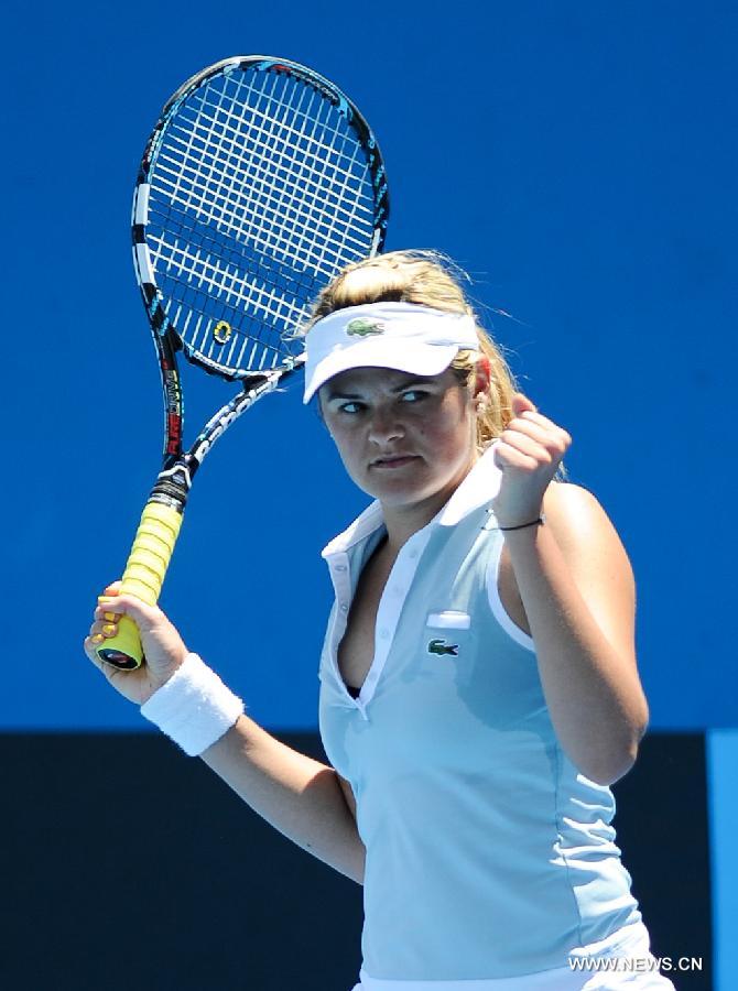 Aleksandra Wozniak of Canada celebrates after winning the 1st round women's singles match against Zhang Shuai of China at 2012 Australian Open tennis tournament at Melbourne Park in Melbourne, Australia , on Jan. 17, 2012. Zhang Shuai lose 0-2. (Xinhua/Bai Xue)
