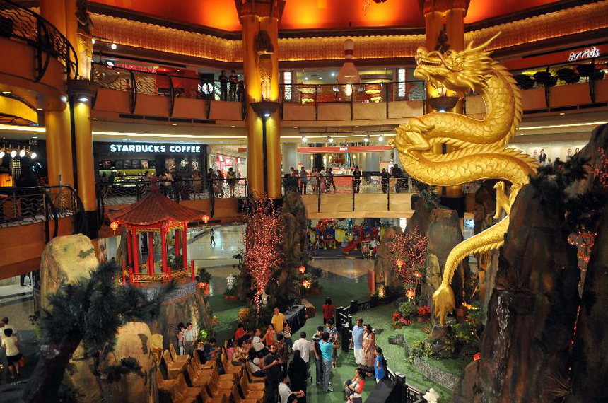 A shopping plaza is decorated with the well-designed dragon statue to celebrate the upcoming Chinese Lunar New Year in Kuala Lumpur, Malaysia, Jan. 16, 2012. Chinese Lunar New year, or the Spring Festival, falls on Jan. 23 this year. 