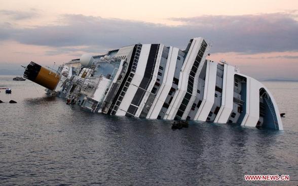 The partially submerged Italian cruise liner Costa Concordia is seen off the west coast of Italy at the Tuscan island of Giglio, Jan. 17, 2012. The death toll from the wreck of Italian cruise liner Costa Concordia rose to eleven on Tuesday as another five bodies were found in the vessel, according to the ANSA news agency. Twenty-four people from the ship are now still missing, and chances of them being found alive are getting fainter. [Wang Yunjia/Xinhua] 
