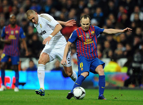 FC Barcelona continued their domination over Real Madrid with a 2-1 win in Madrid's Santiago Bernabeu Stadium in the first leg of their Copa del Rey quarterfinal on Wednesday night.