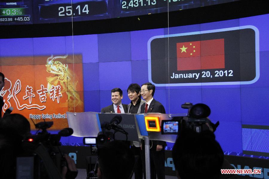 Chinese Consul General Sun Guoxiang, pianist Lang Lang and Senior Vice-President of Nasdaq Robert McCooey (from R to L) ring the opening bell of the Nasdaq Exchange in New York, the United States, on Jan. 20, 2012. The Nasdaq Exchange held a bell-ring ceremony to mark the Chinese New Year, the Year of Dragon, on Friday.