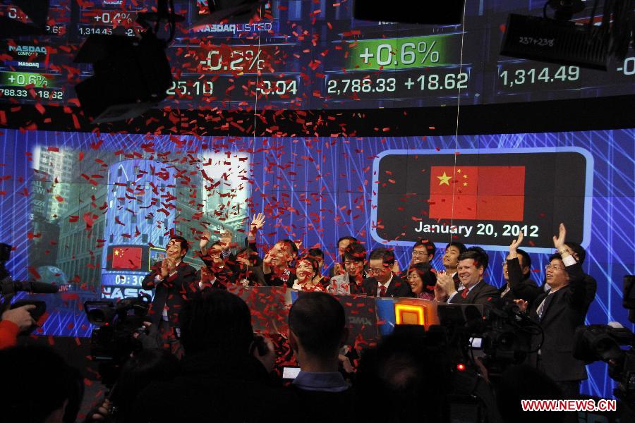 Chinese Consul General Sun Guoxiang, pianist Lang Lang and Senior Vice-President of Nasdaq Robert McCooey (from R to L) ring the opening bell of the Nasdaq Exchange in New York, the United States, on Jan. 20, 2012. The Nasdaq Exchange held a bell-ring ceremony to mark the Chinese New Year, the Year of Dragon, on Friday.