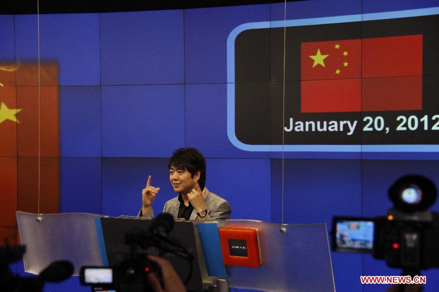 Chinese pianist Lang Lang attends the opening bell ceremony of the Nasdaq Exchange in New York, the United States, on Jan. 20, 2012. The Nasdaq Exchange held a bell-ring ceremony to mark the Chinese New Year, the Year of Dragon, on Friday. 