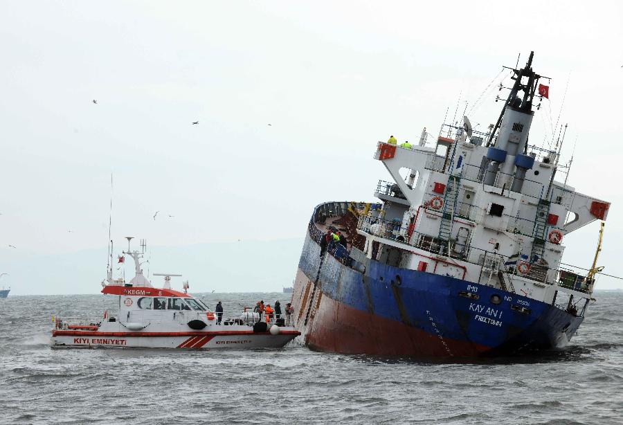 Rescue team and medical team approach the damaged cargo ship, Kayan-1, in Istanbul, Turkey, Jan. 20, 2012. The Sierra Leone-flagged cargo ship, Kayan-1, on Friday crashed into Dutch-flagged Slochterdiep and Tanzania-flagged Adria Blu due to strong wind. All the 30 crew members onboard Kayan-1 survived and the other two ships were reportedly slightly damaged in the crash. 