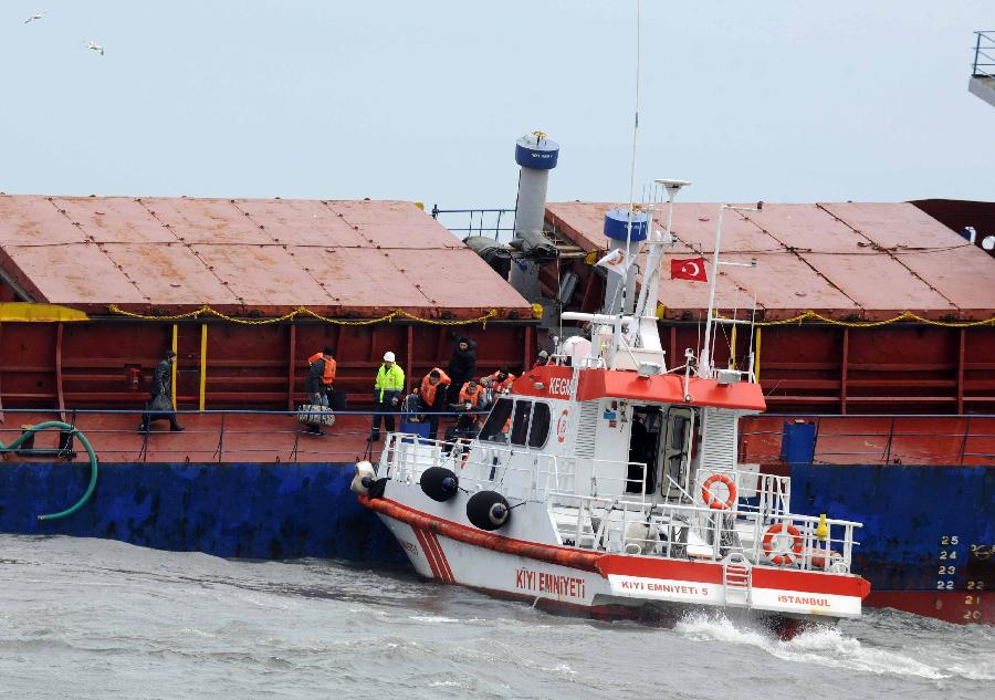 Rescuers reach the stranded cargo ship, Kayan-1, in Istanbul, Turkey, Jan. 20, 2012. The Sierra Leone-flagged cargo ship, Kayan-1, on Friday crashed into Dutch-flagged Slochterdiep and Tanzania-flagged Adria Blu due to strong wind. All the 30 crew members onboard Kayan-1 survived and the other two ships were reportedly slightly damaged in the crash.