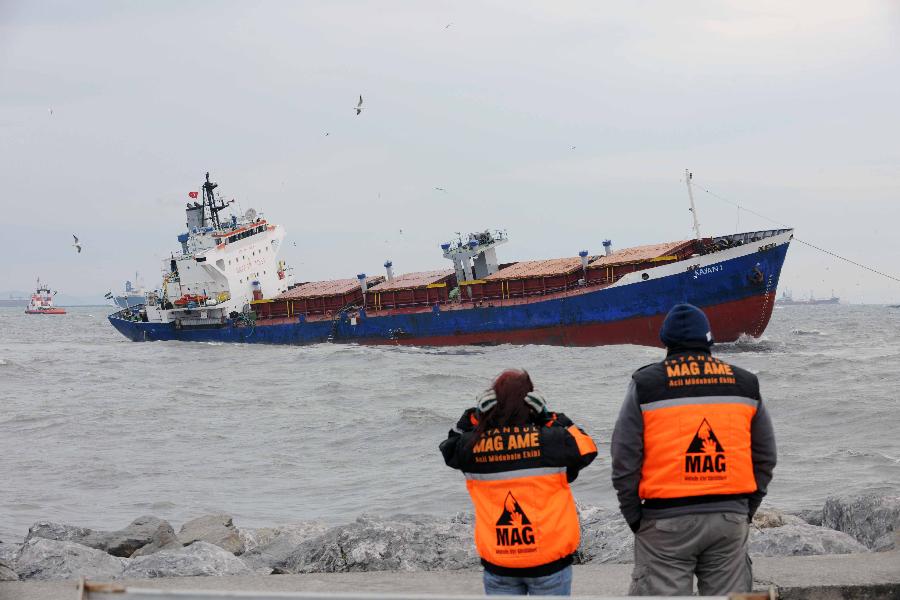 Rescuers watch the stranded cargo ship, Kayan-1, in Istanbul, Turkey, Jan. 20, 2012. The Sierra Leone-flagged cargo ship, Kayan-1, on Friday crashed into Dutch-flagged Slochterdiep and Tanzania-flagged Adria Blu due to strong wind. All the 30 crew members onboard Kayan-1 survived and the other two ships were reportedly slightly damaged in the crash.