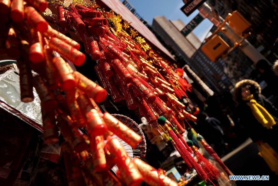 Photo taken on Jan. 20, 2012 shows a shop decorated with festival ornaments at China Town in New York, the United States, Jan. 20, 2012. Shopkeepers sold various ornaments in their shops at China Town for the approaching Spring Festival. 