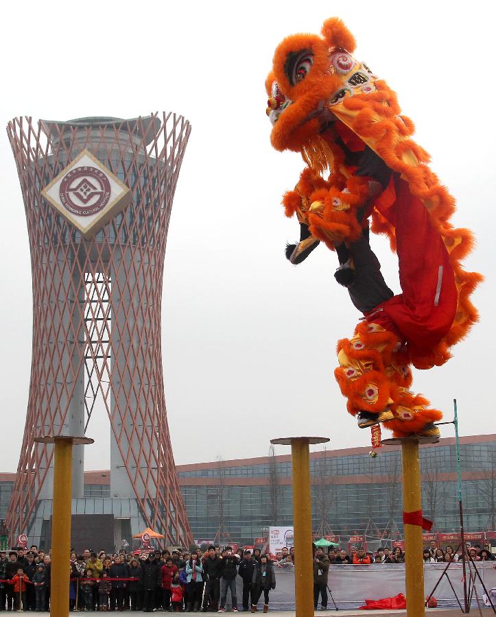 A lion dance team performs during a temple fair held at the intangible cultural heritage garden in Chengdu, capital of southwest China's Sichuan Province, Jan. 22, 2012, the last day of the Chinese lunar Year of Rabbit. More than 10 lion dance and dragon dance teams attended the temple fair that kicked off here on Sunday. 