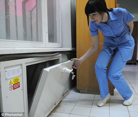 A nurse at the Sochi perinatal centre demonstrates their baby drop box. [Agencies]