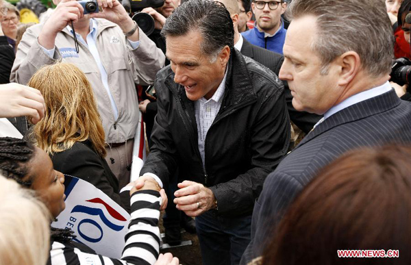 Republican presidential candidate, former Massachusetts Gov. Mitt Romney shakes hands with a little girl after a campaign in Gilbert, South Carolina, Jan. 20, 2012. [Xinhua File Photo]