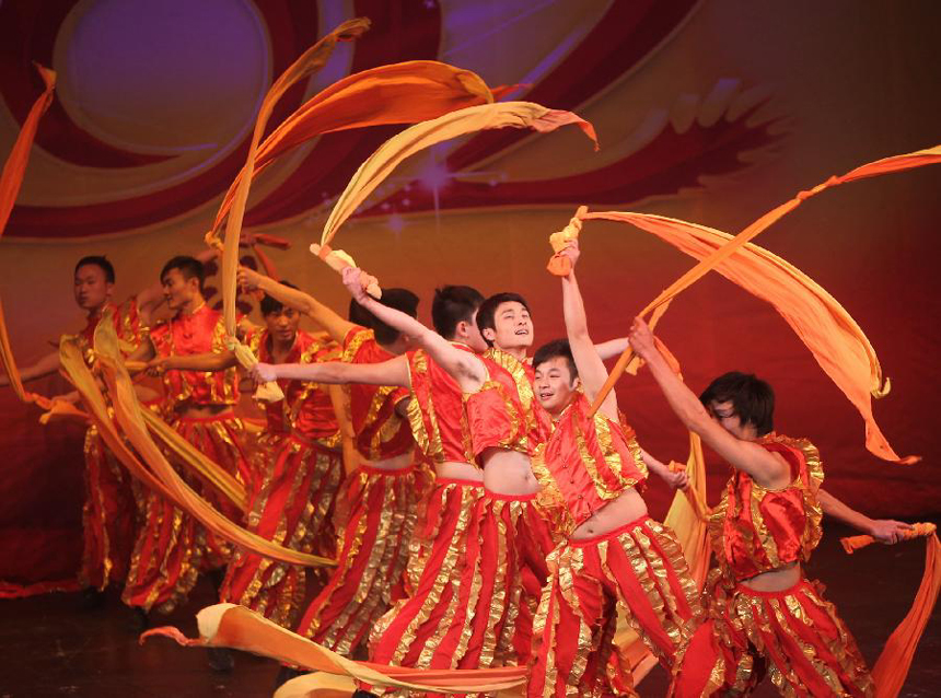 Artists from central China's Hunan Province take part in a performance for celebrating the Chinese Lunar New Year in St. Petersburg, Russia, Jan. 30, 2012.