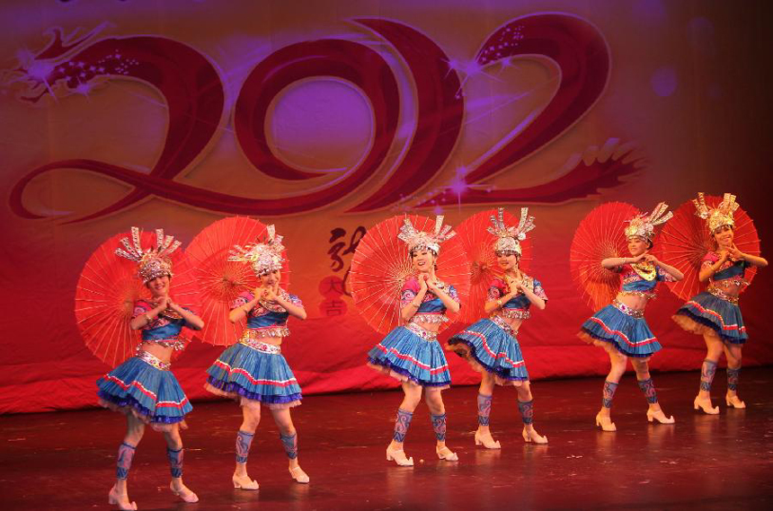 Artists from central China's Hunan Province take part in a performance for celebrating the Chinese Lunar New Year in St. Petersburg, Russia, Jan. 30, 2012.
