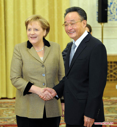 Wu Bangguo (R), chairman of the Standing Committee of the National People's Congress (NPC) of China, meets with German Chancellor Angela Merkel in Beijing, capital of China, Feb. 3, 2012. [Li Tao/Xinhua]
