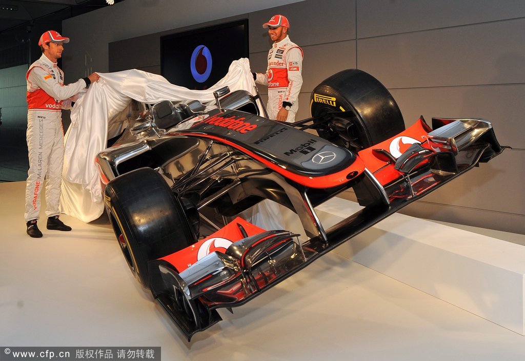 Lewis Hamilton (R) and Jenson Button (L) from Britain unveil the new 2012 Vodaphone McClaren Mercedes at The McLaren Technology Centre, Woking, Britain, 01 February 2011. 