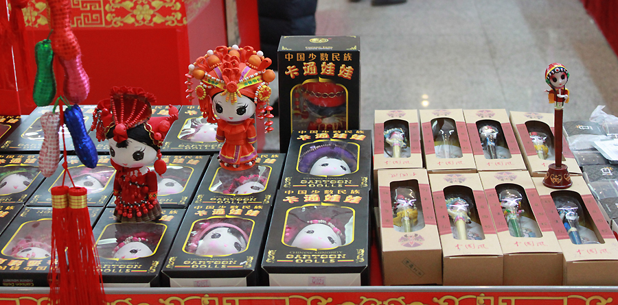 Chinese dolls are on display in an indoor temple fair in the Golden Resources Shopping Mall located in the northwest part of Beijing during the Spring Festival 2012, where visitors can enjoy the charm of the traditional Chinese arts and the delicacy of local snacks. [By Xu Lin / China.org.cn]