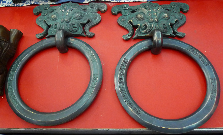 Door knockers are on display in an indoor temple fair in the Golden Resources Shopping Mall located in the northwest part of Beijing during the Spring Festival 2012, where visitors can enjoy the charm of the traditional Chinese arts and the delicacy of local snacks. [By Xu Lin / China.org.cn]