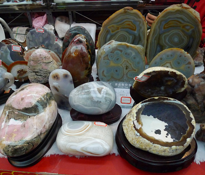 Art stones are on display in an indoor temple fair in the Golden Resources Shopping Mall located in the northwest part of Beijing during the Spring Festival 2012, where visitors can enjoy the charm of the traditional Chinese arts and the delicacy of local snacks. [By Xu Lin / China.org.cn]