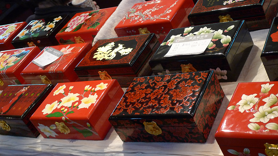 Pretty caskets are on display in an indoor temple fair in the Golden Resources Shopping Mall located in the northwest part of Beijing during the Spring Festival 2012, where visitors can enjoy the charm of the traditional Chinese arts and the delicacy of local snacks. [By Xu Lin / China.org.cn]