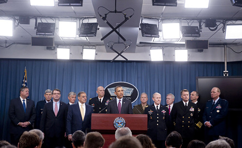  U.S. President Barack Obama, flanked by military officials, speaks about a new defense strategic review during a press briefing at the Pentagon in Washington, D.C. on January 5. The review outlined U.S. defense budget priorities and the strategic shift toward Asia [XINHUAN/AFP]
