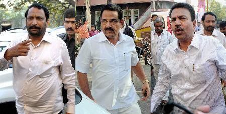 BJP ministers (L-R) Lakshman Savadi, Krishna Palemar and CC Patil, accused of watching porn clip in the Karnataka assembly, arrive at the party office in Bangalore on Wednesday. The ministers 'voluntarily' resigned on Wednesday. [Agencies]