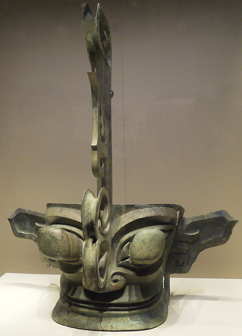 Bronze mask, Shang Dynasty (c. 16th-11th centuries BC), unearthed at Sanxingdui, Guanghan, Sichuan Province. It is exhibited in the section of Exhibition on life, production in Xia, Shang and Western Zhou Dynasties, an exhibition of Ancient China in the National Museum of China. [Photo by Xu Lin / China.org.cn]