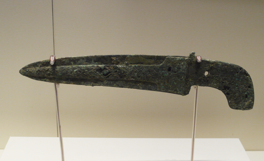 Bronze Ge (dagger-axe) Inlaid with Turquoise, Shang Dynasty (c. 16th-11th centuries BC), King Wu Ding's reign, unearthed from tomb of Fu Hao at Yinxu, Anyang, Henan Province, 1976. It is exhibited in the section of Exhibition on life, production in Xia, Shang and Western Zhou Dynasties, an exhibition of Ancient China in the National Museum of China. [Photo by Xu Lin / China.org.cn]