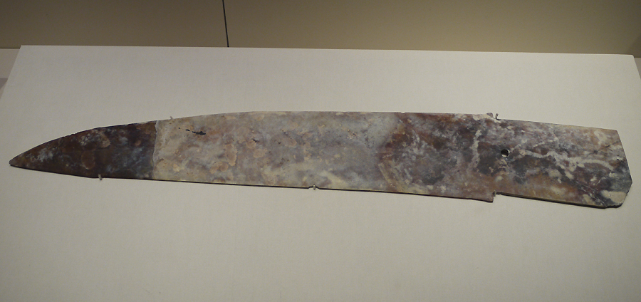 Jade Ge (dagger-axe), c. 15th century BC, unearthed at Panlongcheng, Huangpi, Hubei Province, 1974. It is exhibited in the section of Exhibition on life, production in Xia, Shang and Western Zhou Dynasties, an exhibition of Ancient China in the National Museum of China. [Photo by Xu Lin / China.org.cn]