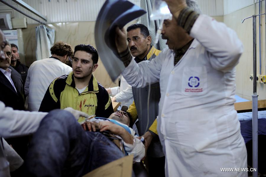 A policeman wounded during the explosion receives medical treatment at a hospital in Aleppo, northern Syria, Feb. 10, 2012. Twin deadly blasts caused by car bombs hit two sites of Syrian government forces in northern Aleppo province Friday, leaving 28 people killed and other 235 injured, said Syria's official media, blaming the attacks on armed groups backed by foreign plot. 