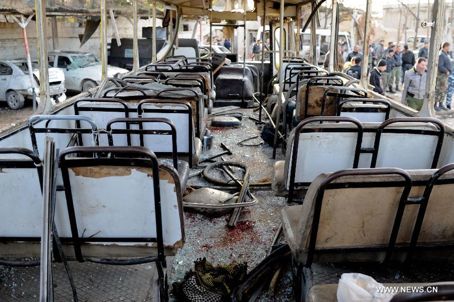 Photo taken on Feb. 10, 2012 shows the explosion site of a law-enforcement force in Hanano area in Aleppo, northern Syria. Twin deadly blasts caused by car bombs hit two sites of Syrian government forces in northern Aleppo province Friday, leaving 28 people killed and other 235 injured, said Syria's official media, blaming the attacks on armed groups backed by foreign plot.