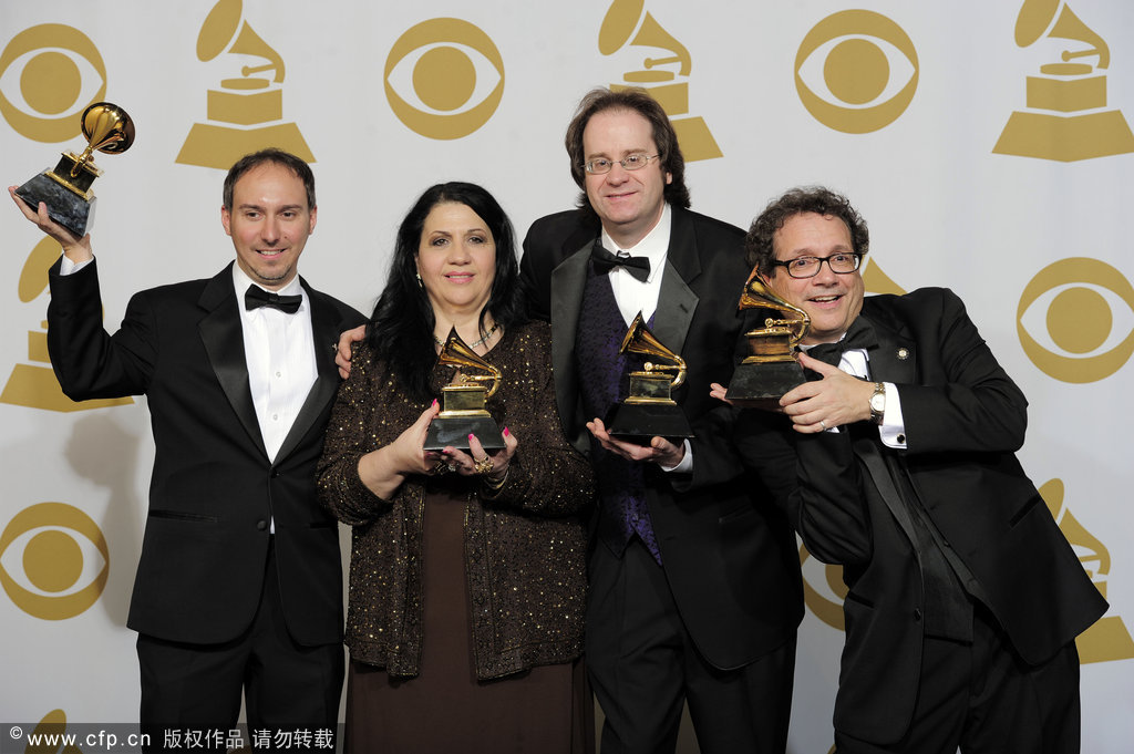 (L to R), Jim Cravero, Gloria Domina, Kevin Mackie and Steve Pullara pose backstage with their awards for best children's album for 'All about Bullies... Big and Small' at the 54th annual Grammy Awards on Sunday, Feb. 12, 2012 in Los Angeles.