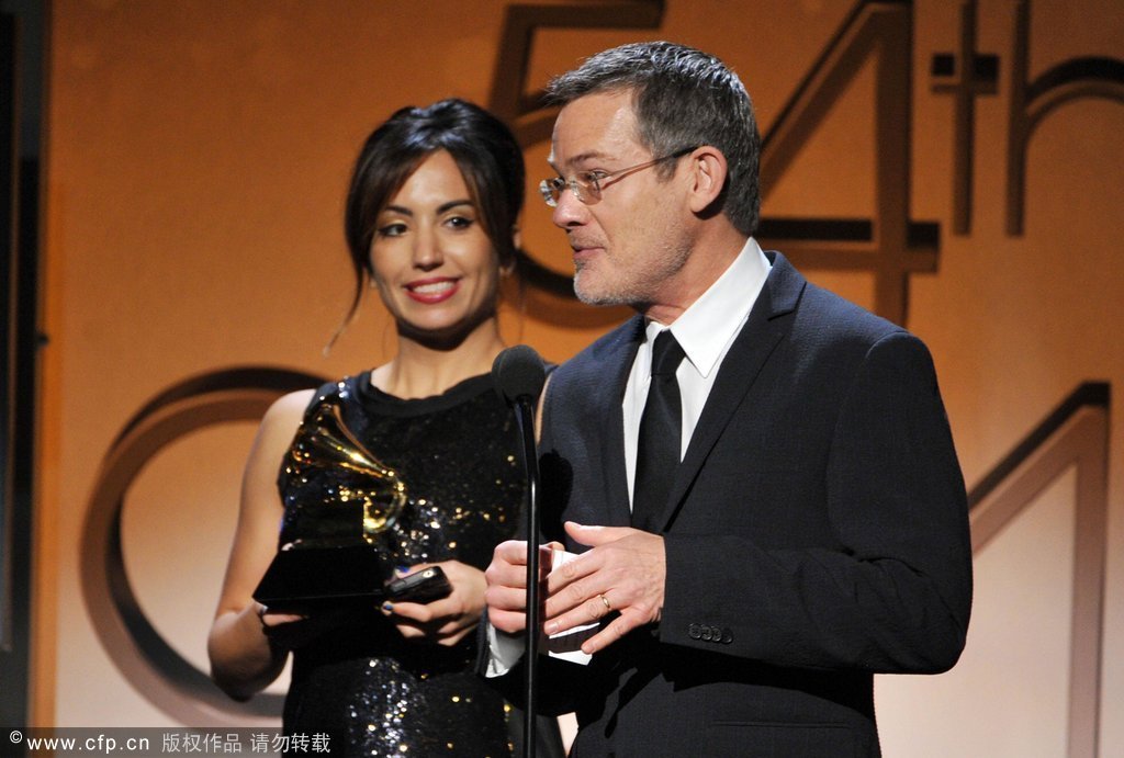 Art Directors Michelle Holme (L) and Dave Bett accept the Best Boxed or Special Limited Edition Package Award for The Promise: The Darkness on the Edge of Town Story (Bruce Springsteen) onstage at the 54th Annual Grammy Awards held at Staples Center on February 12, 2012 in Los Angeles, California.