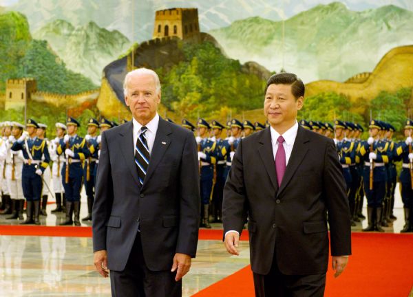 Chinese Vice President Xi Jinping (R) holds a welcoming ceremony for U.S. Vice President Joe Biden in Beijing, capital of China, Aug. 18, 2011. [Li Xueren/Xinhua]