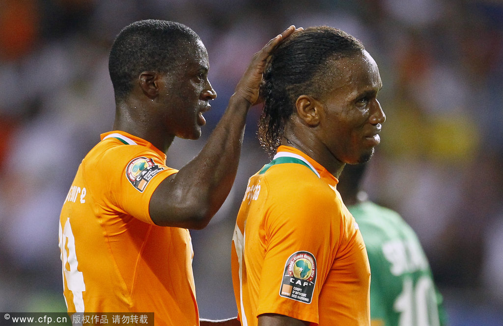 Ivory Coast captain Didier Drogba (right) is comforted by Yaya Toure after he missed his penalty kick against Zambia goalkeeper Mweene Kennedy during their their African Cup of Nations final soccer match at Stade de I'amitie in Libreville, Gabon, on Sunday, Feb. 12, 2012.