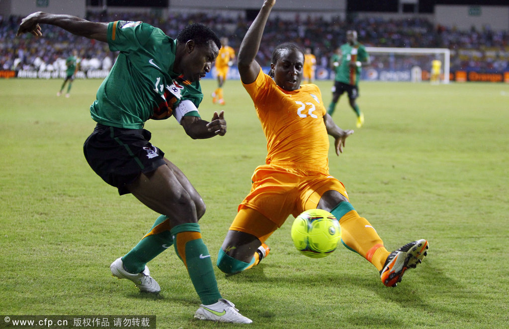 Ivory Coast's Souleymane Bamba (right) is challenged by Zambia's Christopher Katongo during their African Cup of Nations final soccer match at Stade de I'amitie in Libreville, Gabon, on Sunday, Feb. 12, 2012.