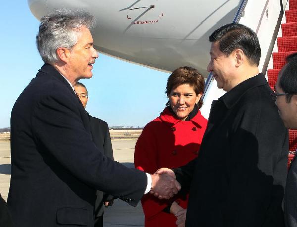 Chinese Vice President Xi Jinping (2nd R) is greeted by U.S. Deputy Secretary of State William Burns (L) upon his arrival in Washington, capital of the United States, Feb. 13, 2012. Xi Jinping arrived in Washington Monday afternoon, kicking off his official visit to the United States. [Lan Hongguang/Xinhua] 
