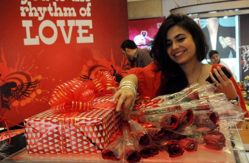 Pakistani girl selects roses in a shopping mall in southern Pakistani port city of Karachi on Feb. 13, the eve of Valentine's Day.