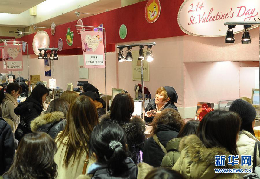 Customers line up to buy chocolates in Tokyo, Japan, on February 12, 2012. 