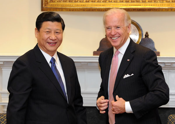 China's Vice-President Xi Jinping (L) meets with U.S. Vice President Joe Biden at the White House in Washington, February 14, 2012. [Xinhua] 