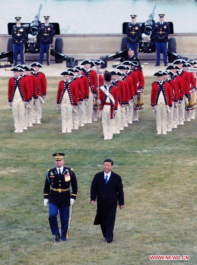 Chinese Vice President Xi Jinping (Front, R) reviews a guard of honor during a welcoming ceremony hosted by U.S. Secretary of Defense Leon E. Panetta prior to their meeting at the Pentagon in Washington, the United States, Feb. 14, 2012. [Liu Jiansheng/Xinhua] 
