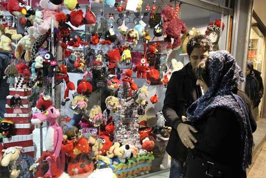 A young Iranian couple look at gifts at a store in Tehran on the eve of Valentine&apos;s Day.