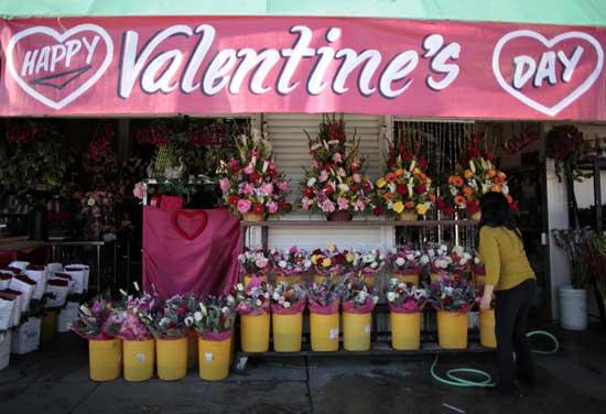 A florist arranges flowers in preparation for Valentine's Day in Los Angeles February 10, 2012.