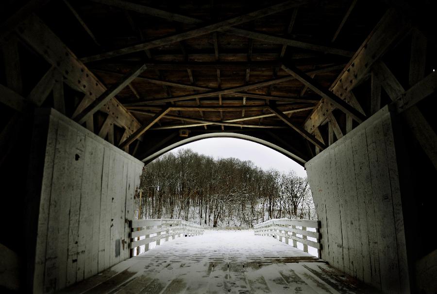 The Roseman Covered Bridge is covered with snow in Winterset, Iowa, the United States, Feb. 13, 2012. More than a decade after the movie 'The Bridges of Madison County' was released, thousands of people still travel to Winterset each year to trace the steps where Clint Eastwood and Meryl Streep immortalized the area's covered bridges. 