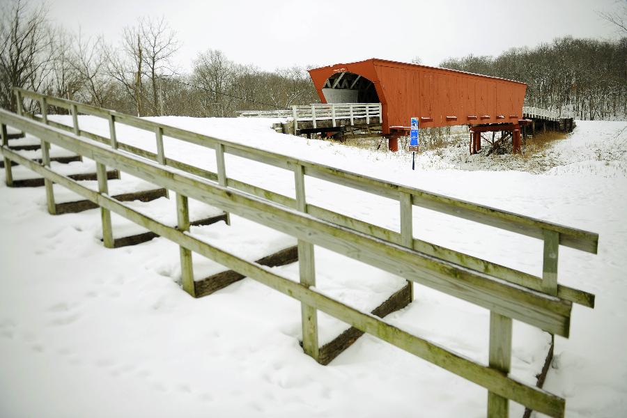 The Roseman Covered Bridge is covered with snow in Winterset, Iowa, the United States, Feb. 13, 2012. More than a decade after the movie 'The Bridges of Madison County' was released, thousands of people still travel to Winterset each year to trace the steps where Clint Eastwood and Meryl Streep immortalized the area's covered bridges. 