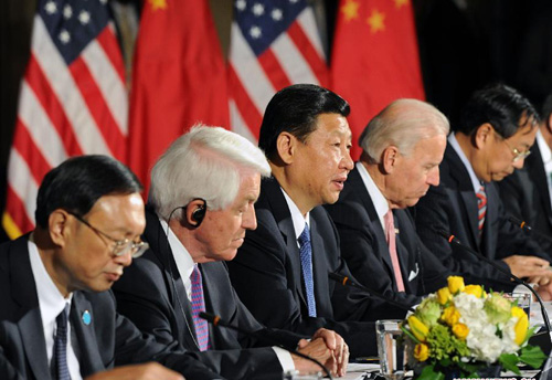 Chinese Vice President Xi Jinping (C) addresses the U.S.-China Business Roundtalbe in Washington, the United States, Feb. 14, 2012. Xi Jinping and his U.S. counterpart Joe Biden (2nd R) attended the business roundtable. 