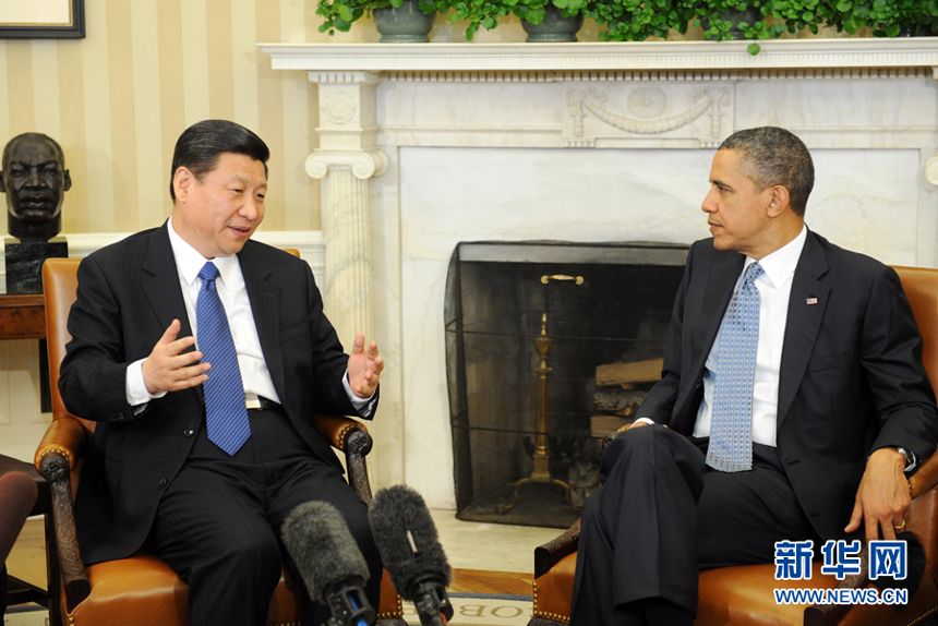 China's Vice-President Xi Jinping (L) meets with US President Barack Obama at the White House in Washington, February 14, 2012. 