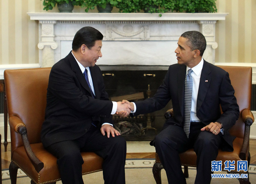 China's Vice-President Xi Jinping (L) meets with US President Barack Obama at the White House in Washington, February 14, 2012. 